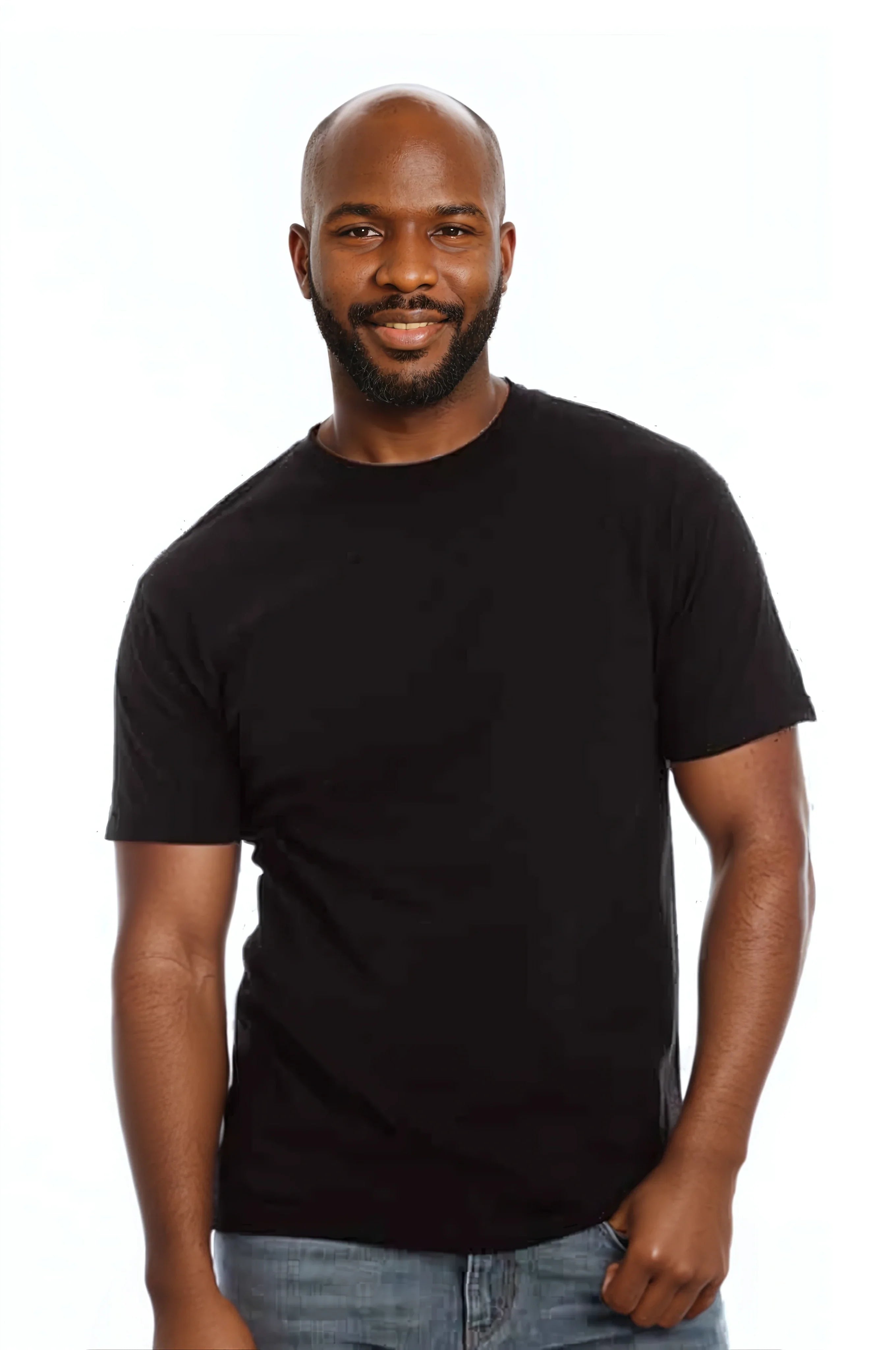 Smiling man in a black t-shirt and jeans against a plain white background.