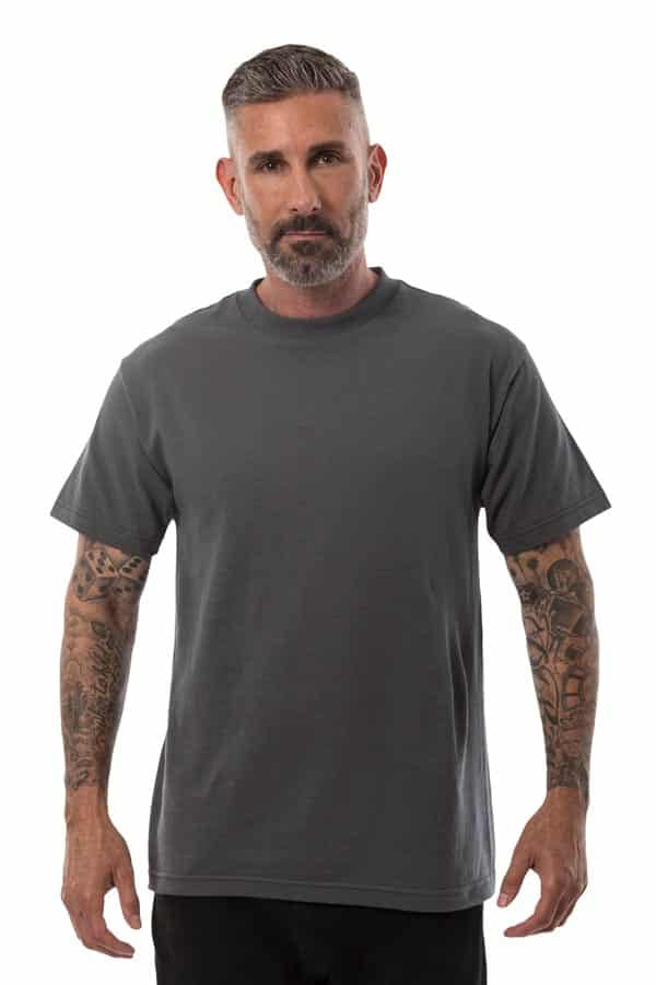 Man with tattoos, short hair, and beard wearing a dark gray T-shirt against a plain white background.