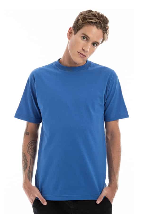 Man in a blue T-shirt with short sleeves, slightly tilting head, showing tattoos on his arms.