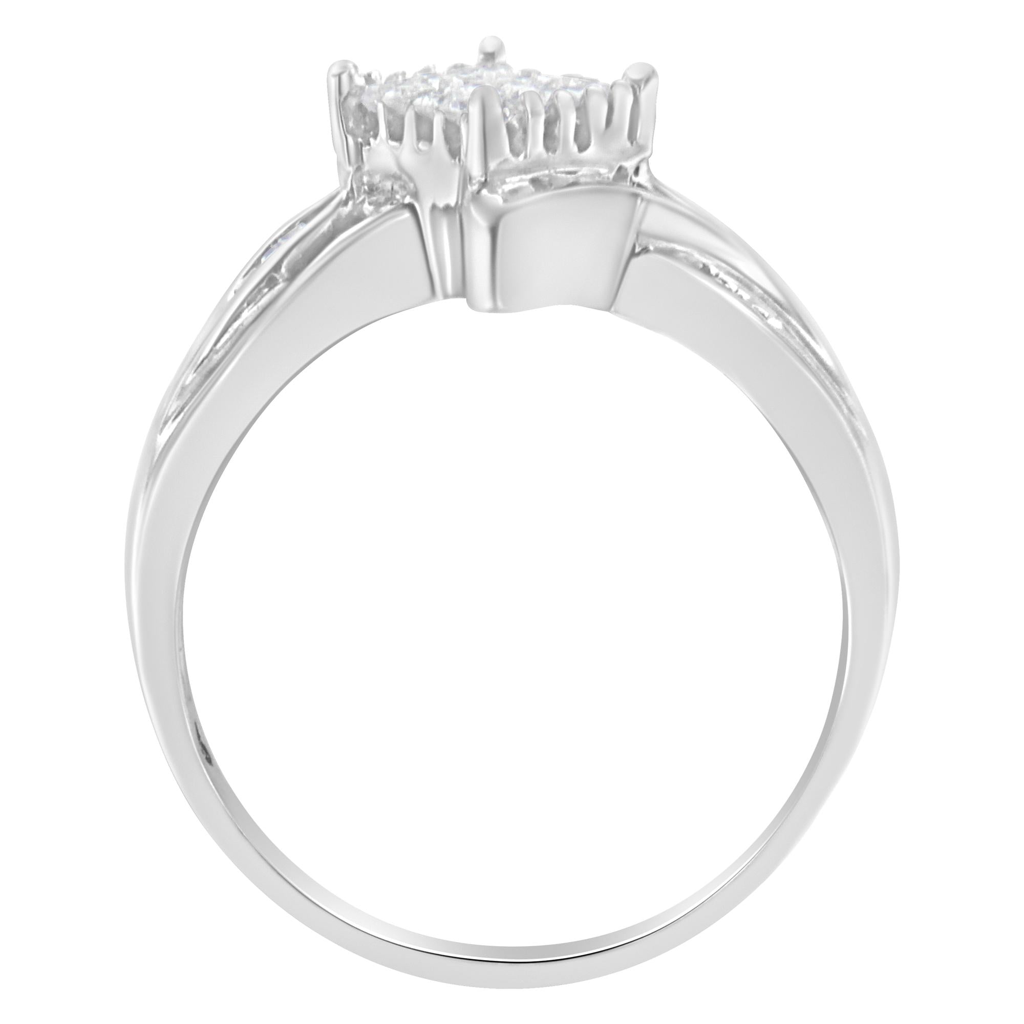 Silver ring with a round diamond cluster on top, sleek and shiny band.