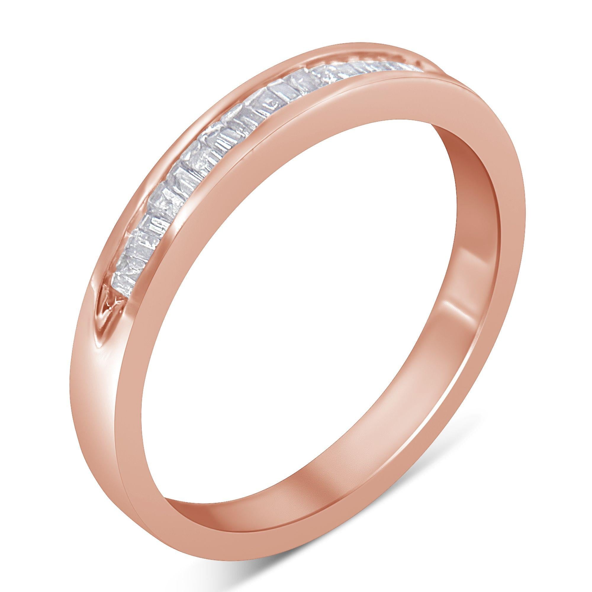 Rose gold ring with a row of small, square-cut clear gemstones inlaid in the band.