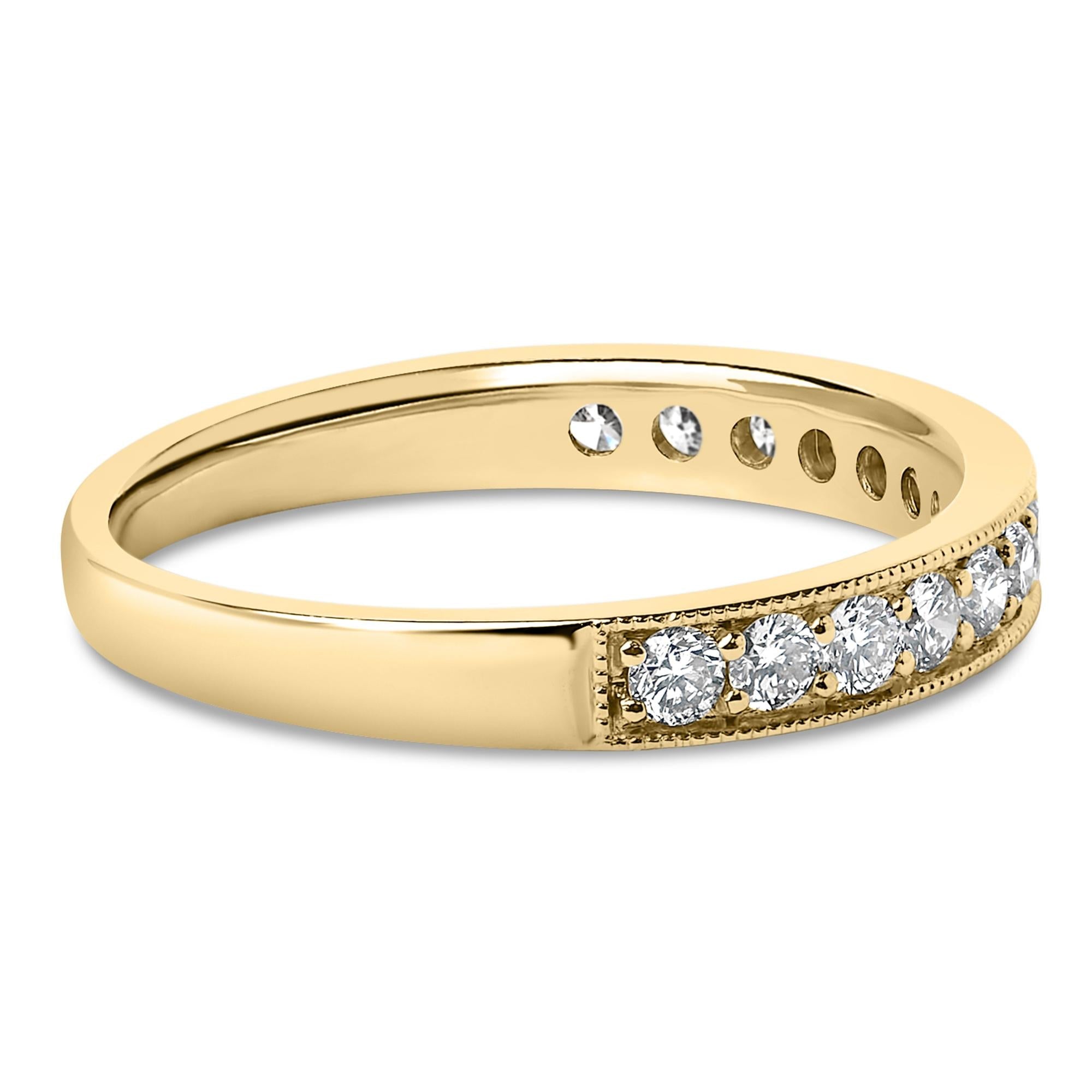 Gold band with round diamonds, six visible, set in a line. Polished, smooth surface.