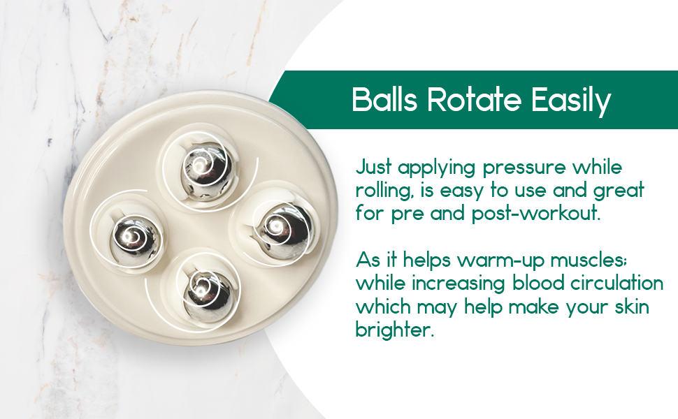 Beige massage roller with four metal balls, text on the side, marble background.