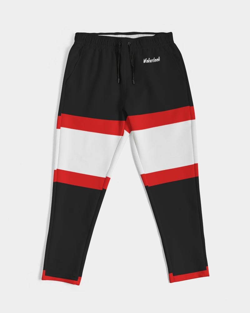 Black pants with red and white horizontal stripes, drawstring waist, and small logo on left side.