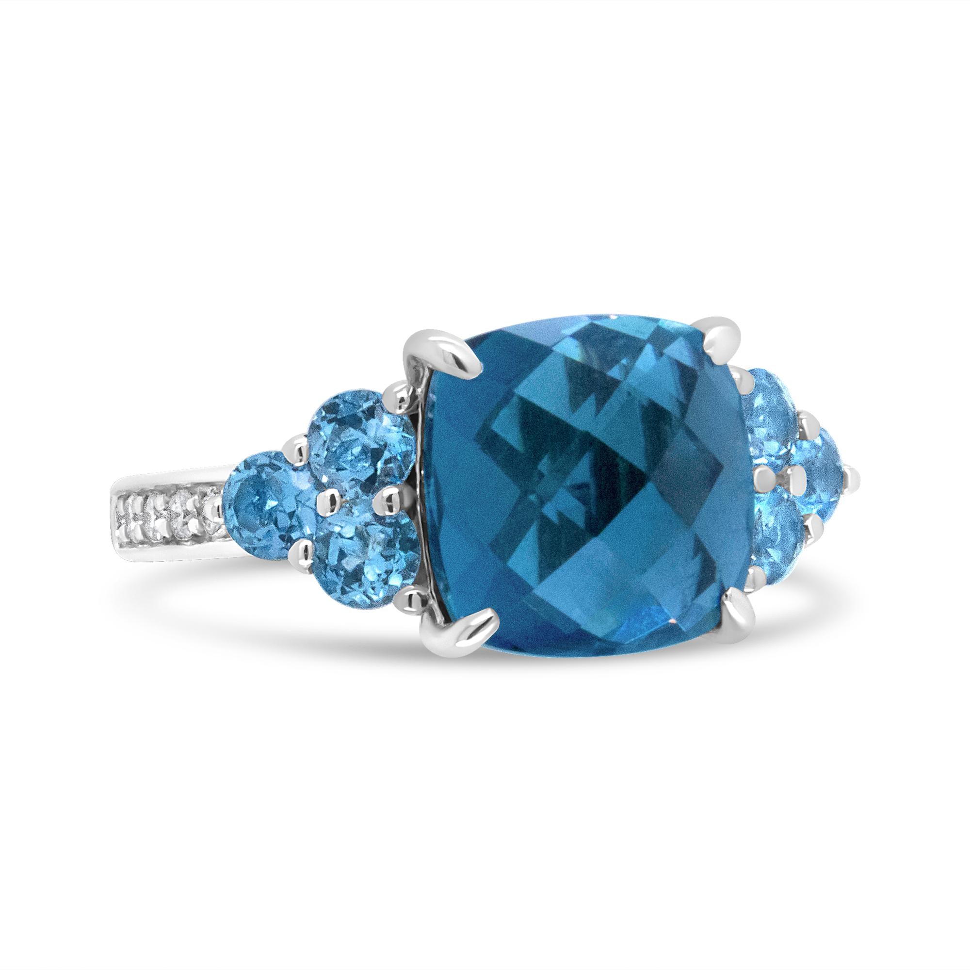 Silver ring with a large blue square gemstone, flanked by smaller round blue stones.