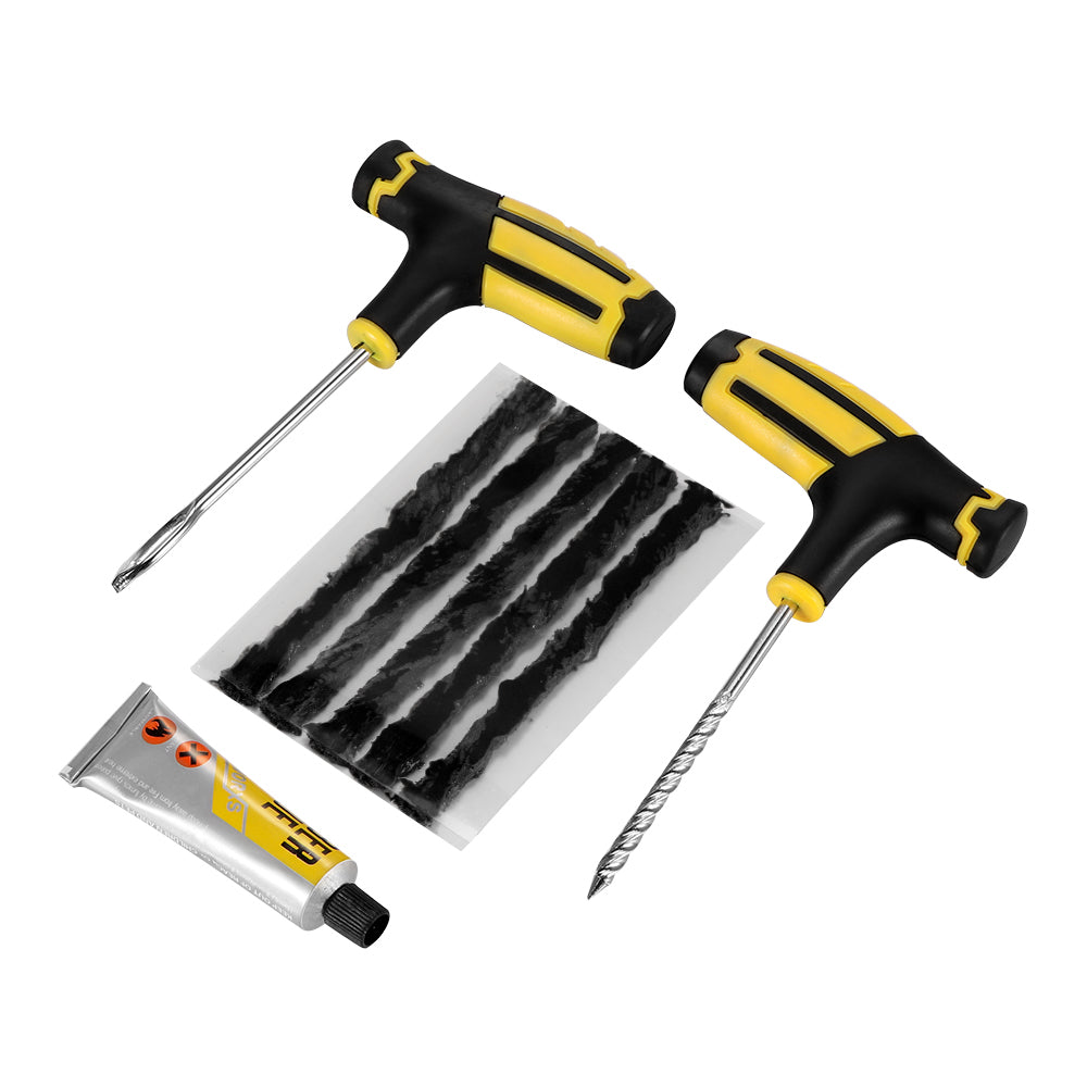Two yellow and black T-handle tools, a tube of glue, and black strips for tire repair.