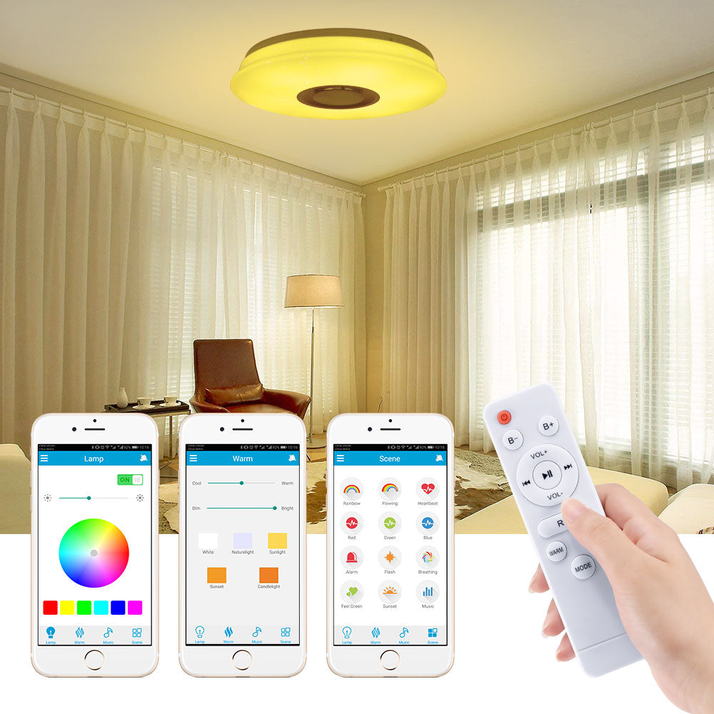 Modern living room with yellow ceiling light, remote, and three smartphones controlling light settings.