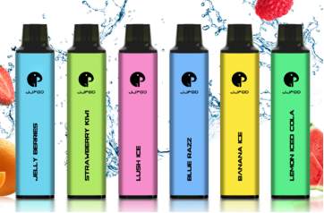 Six colorful vape pens in green, blue, pink, and yellow against a splash of water with fruits.