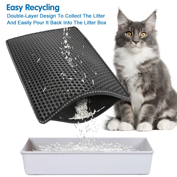 Gray cat beside a black dual-layer litter mat pouring white litter into a white box.