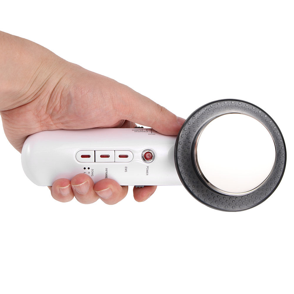 Hand holding a white magnifying glass with a black rim and buttons on the handle.