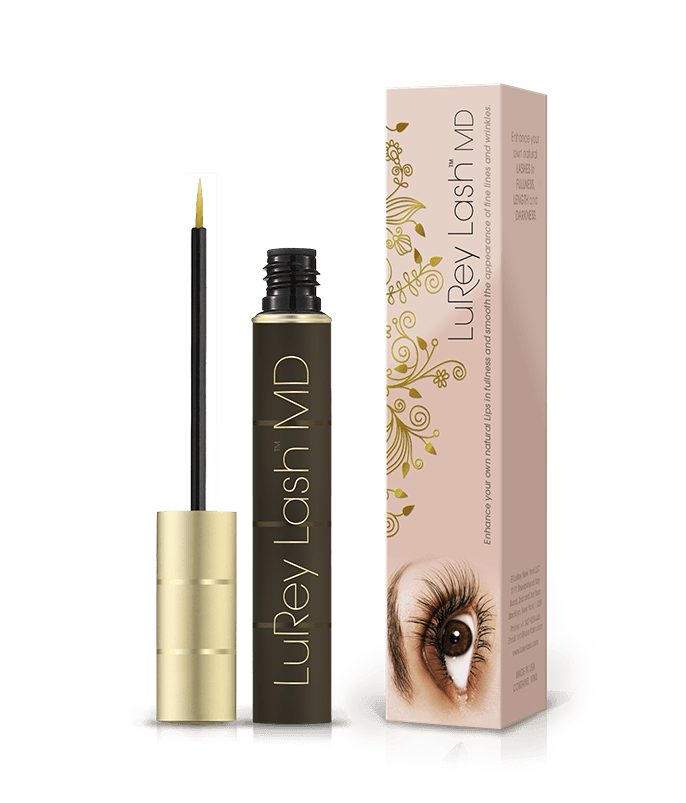 Gold-capped black mascara tube with fine brush beside a floral-patterned box featuring an eye.