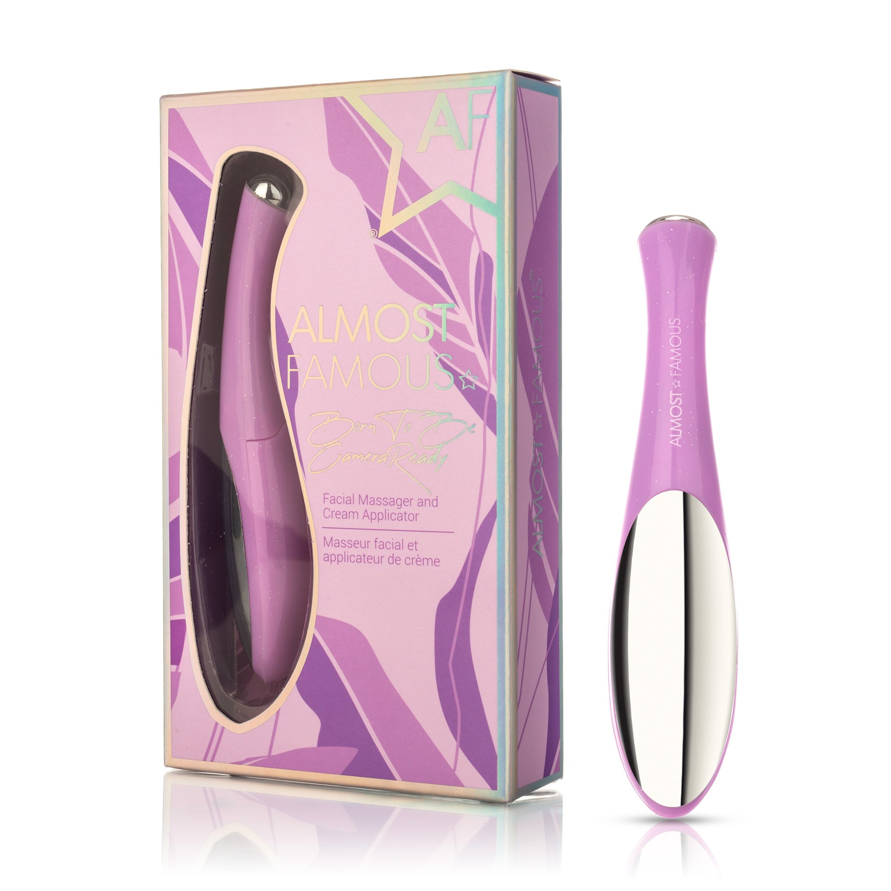 Purple facial massager and cream applicator beside a matching box with decorative text.