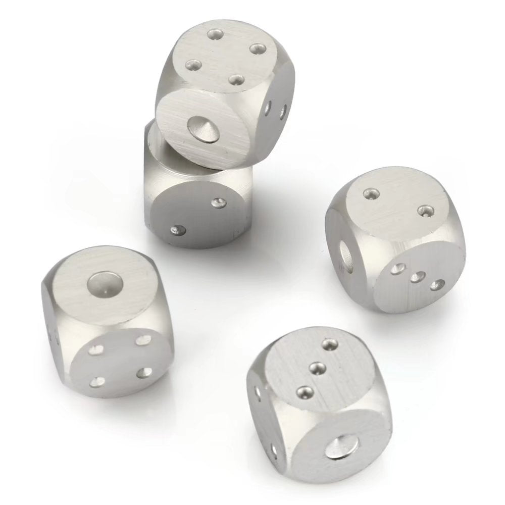 Five silver metal dice with rounded edges, showing various numbers.