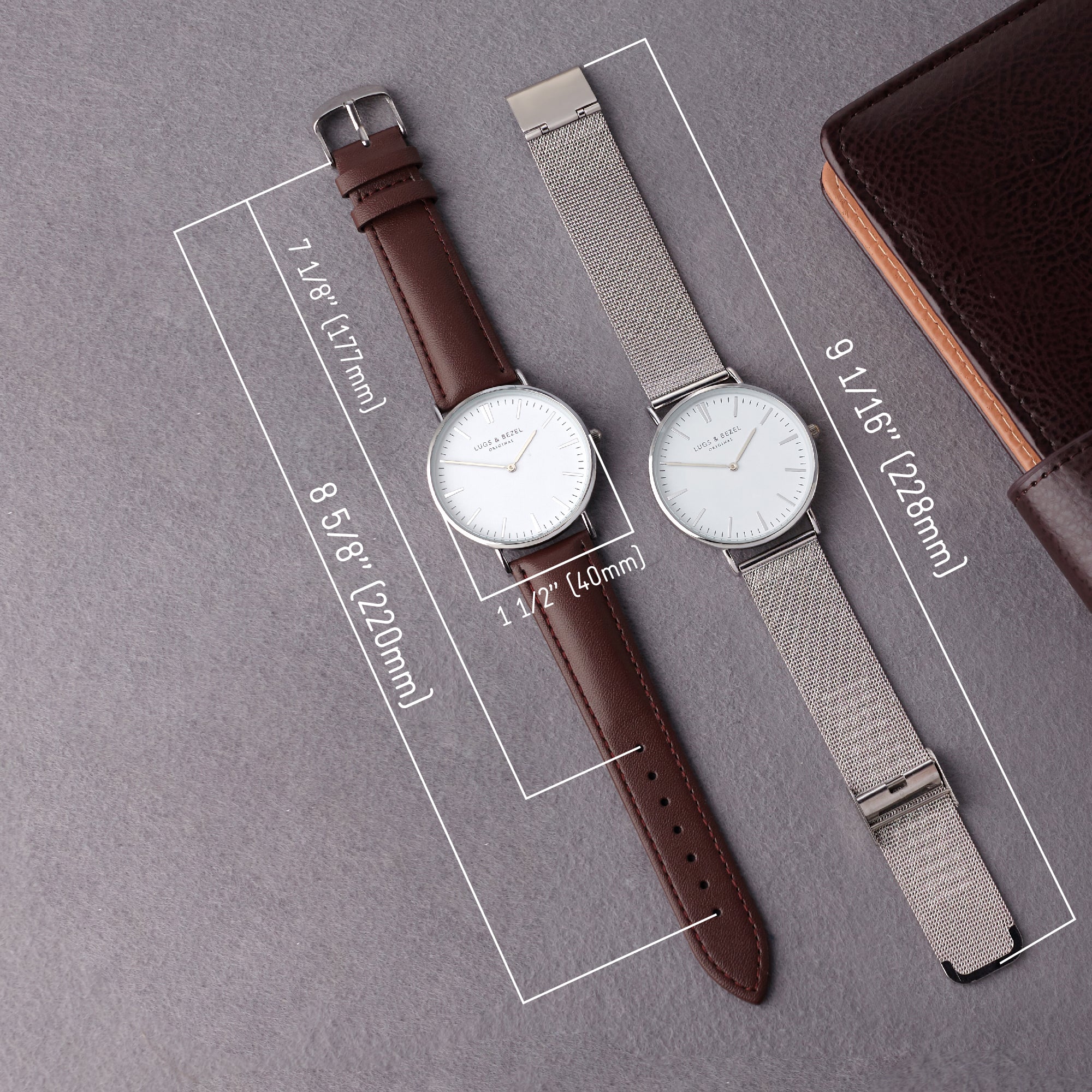 Two minimalist watches: one with a brown leather strap, the other with a silver mesh strap, on gray.