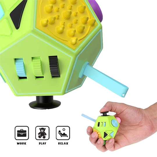 Green fidget cube with various textured buttons and switches; hand holding a smaller version.