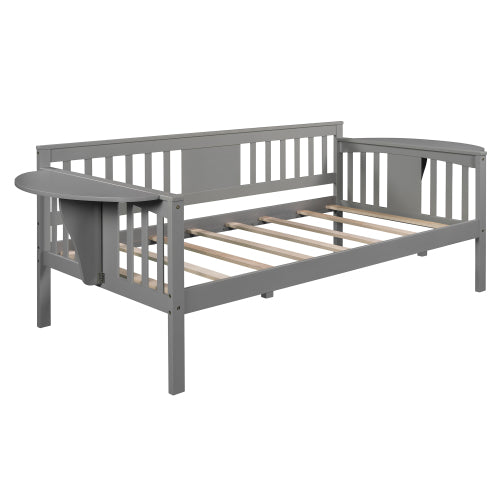 Gray wooden daybed frame with slatted backrest and sides, featuring a foldable side table.