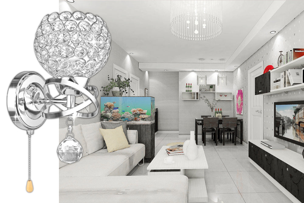 Modern living room with a crystal wall light, aquarium, beige sofa, and sleek white decor.