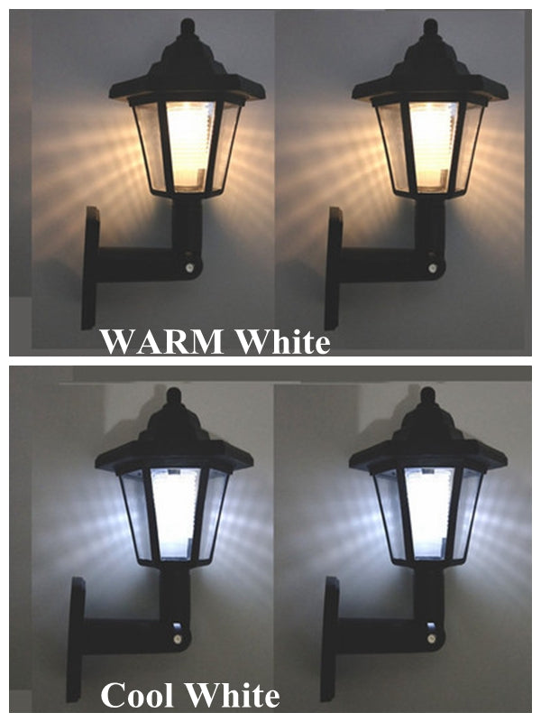 Two black lanterns emit warm white light and two emit cool white light.