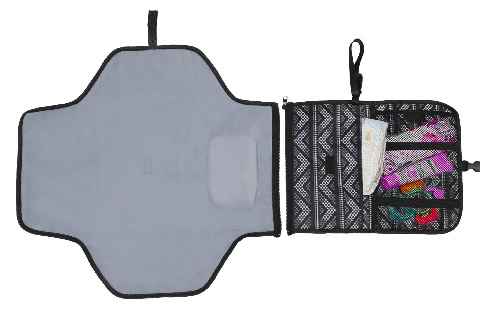 Gray changing mat with black trim, attached black pouch with mesh pockets, visible diapers and items.