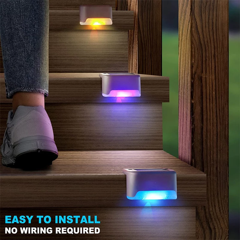 LED-lit stairs with colorful lights in blue, purple, and yellow; person in sneakers ascending.