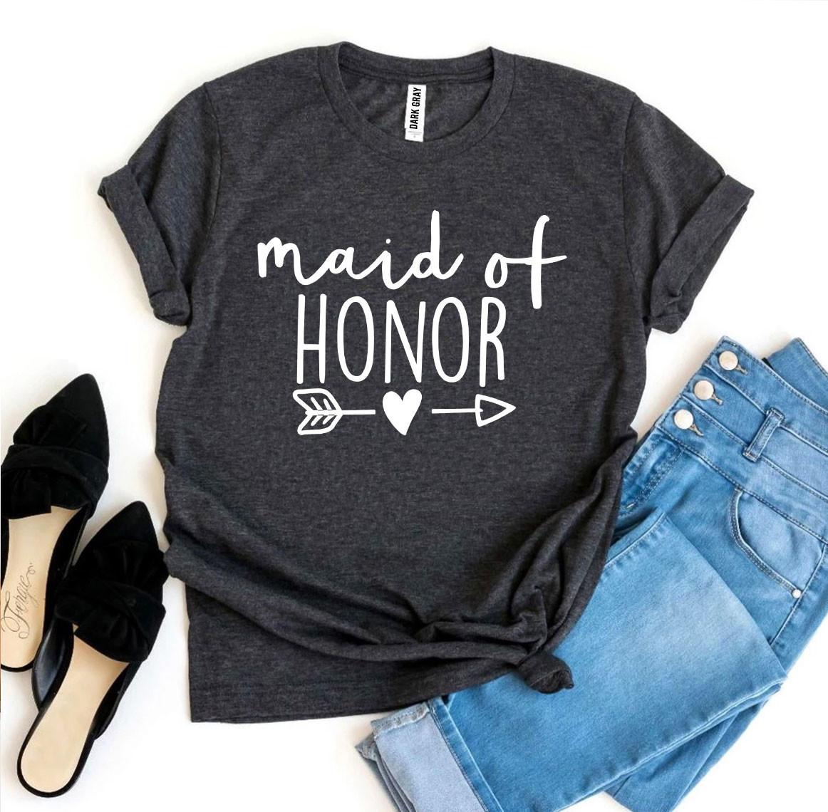 Dark grey T-shirt with "maid of honor" in white, paired with light blue jeans and black shoes.