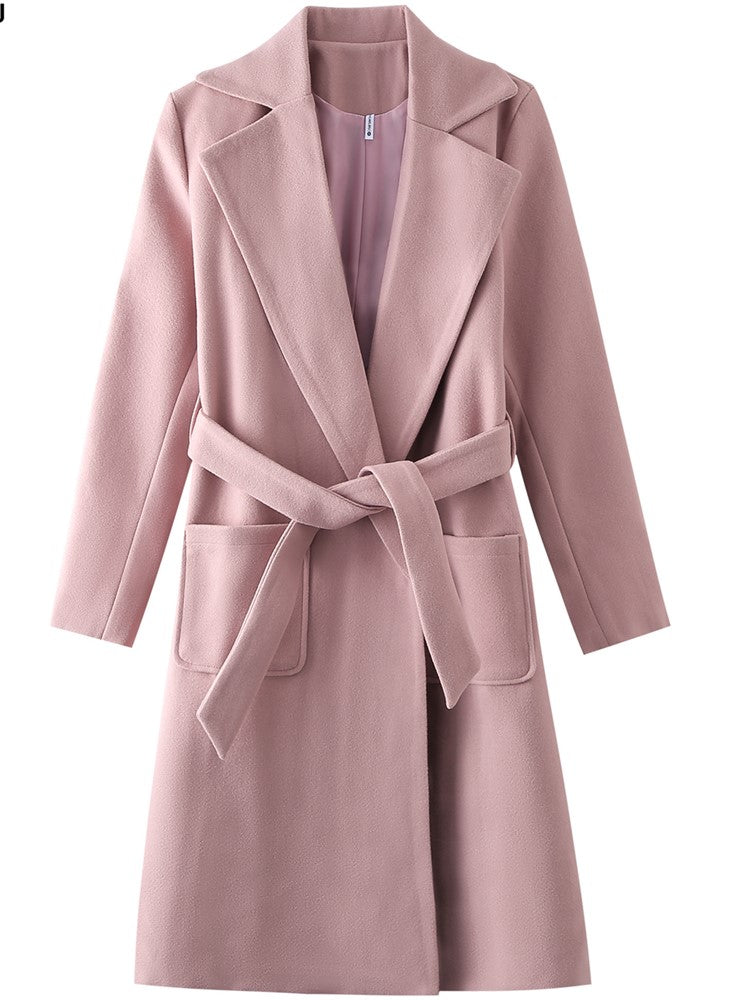 Pink coat with wide lapels and a belt, featuring front pockets on either side.