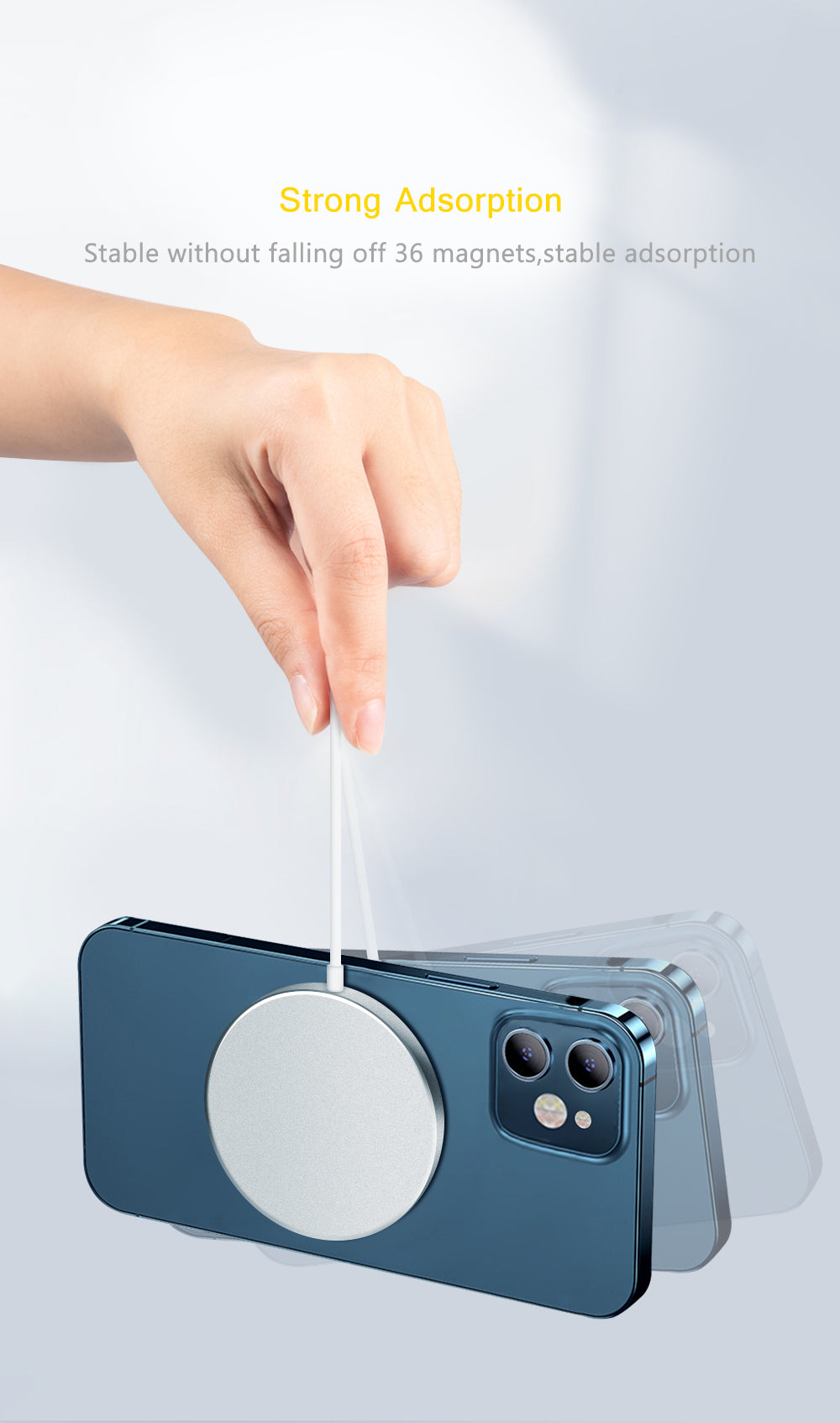 Hand holding a blue phone with a silver magnetic charger, demonstrating strong adhesion.