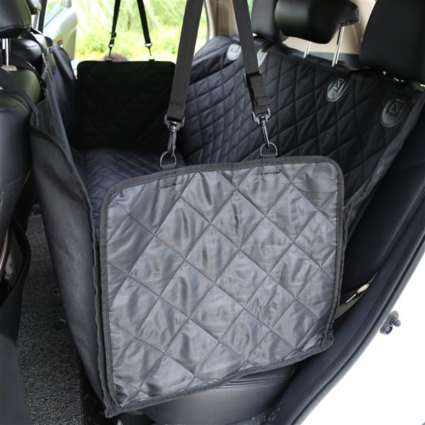Quilted black dog car seat cover with straps in a vehicle&