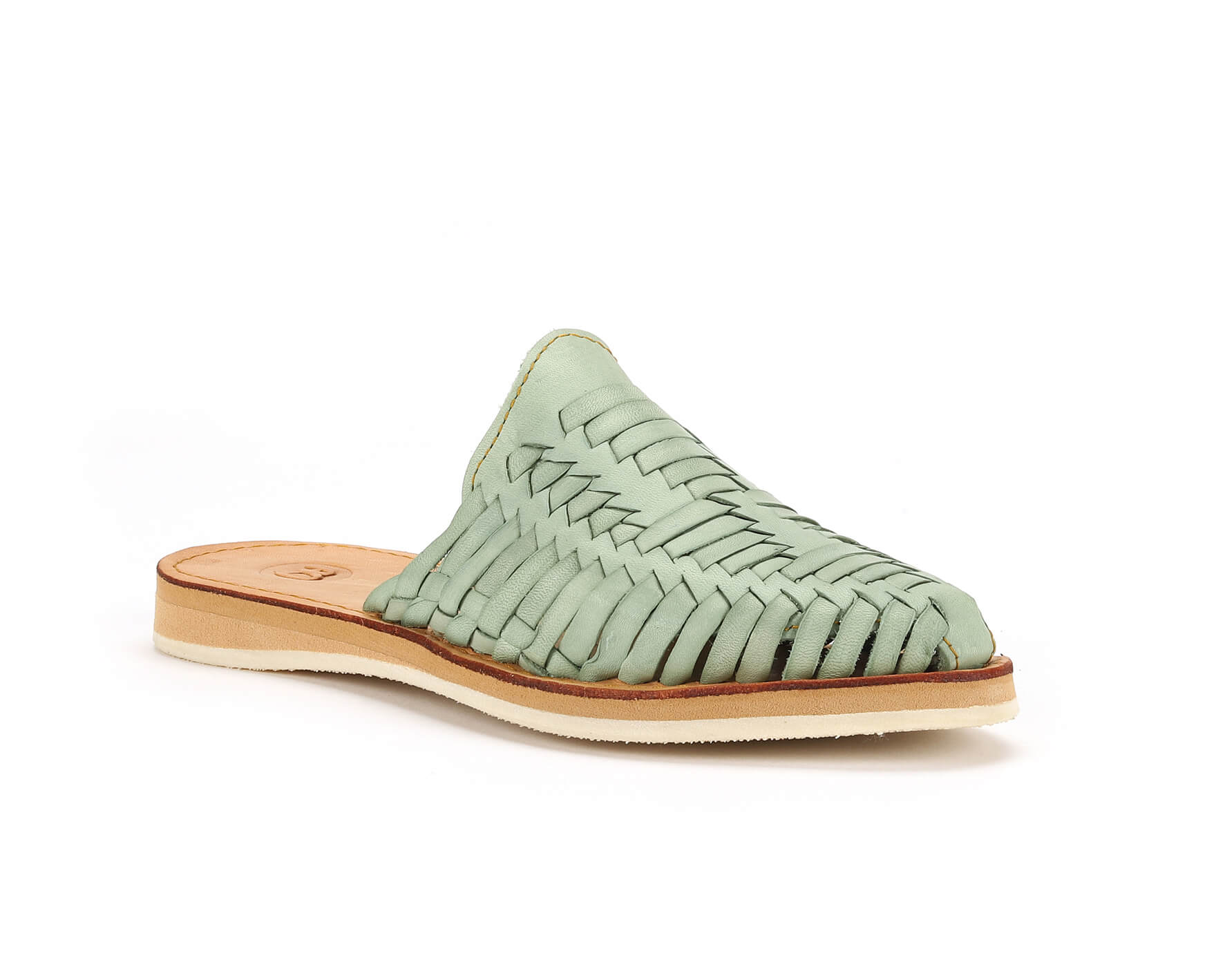 Mint green woven leather slip-on sandal with a tan sole on a white background.
