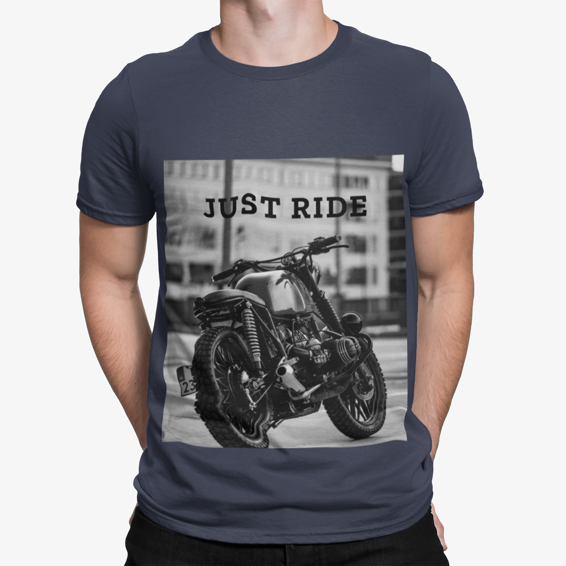 Man in navy T-shirt with black-and-white motorcycle print and "JUST RIDE" text.