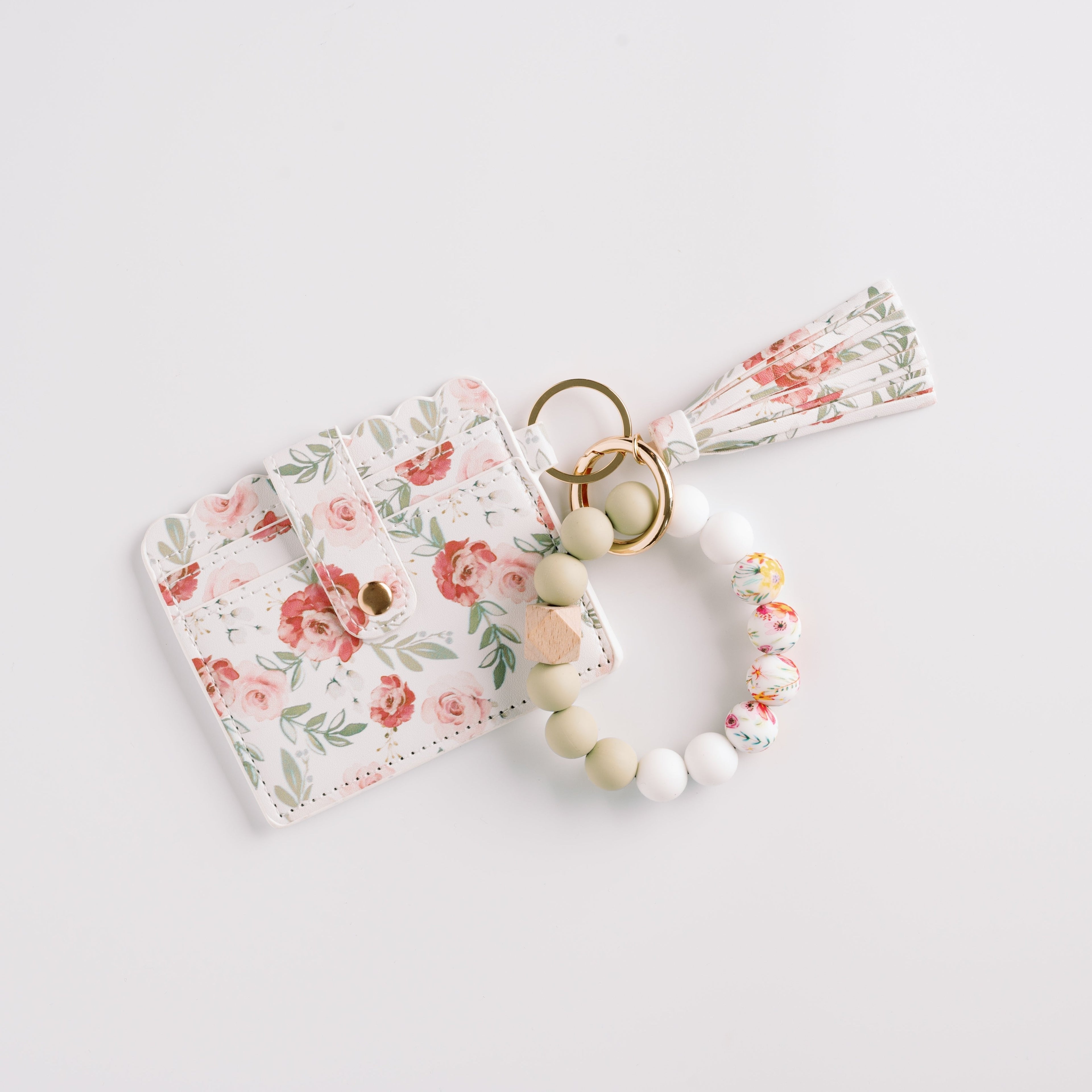 Floral cardholder with a matching tassel and multicolor beaded keychain on a white background.
