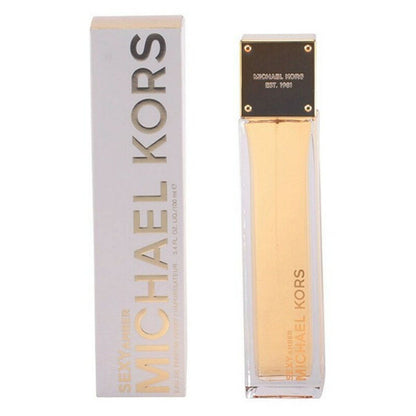 Tall, rectangular perfume bottle with gold top, next to matching white and gold box.