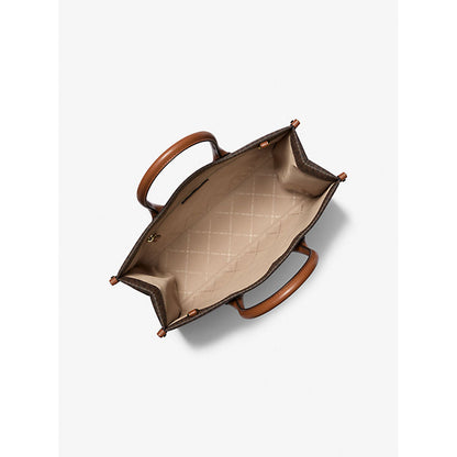 Top view of an open handbag with brown handles, quilted beige interior, and dark patterned exterior.