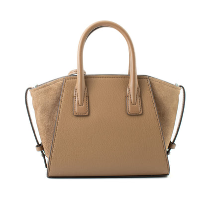 Tan tote bag with textured sides and smooth handles, featuring a structured, trapezoidal shape.