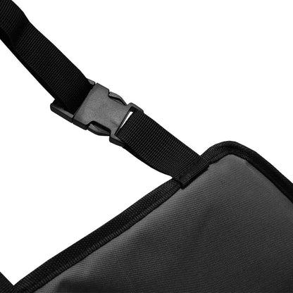 Black strap with a plastic buckle attached to a dark gray fabric.