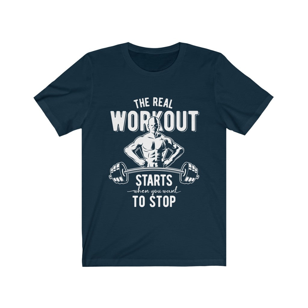 Navy T-shirt with white text and muscular figure holding a barbell: "The Real Workout Starts."