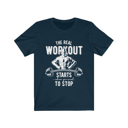 Navy T-shirt with white text and muscular figure holding a barbell: "The Real Workout Starts."