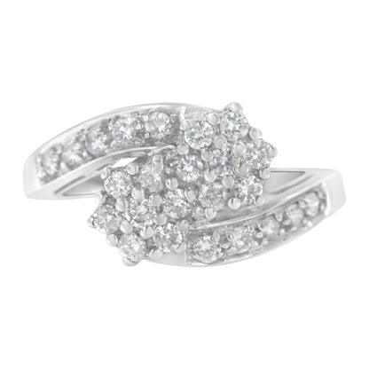 Silver ring with diamond clusters and shimmering band accents.