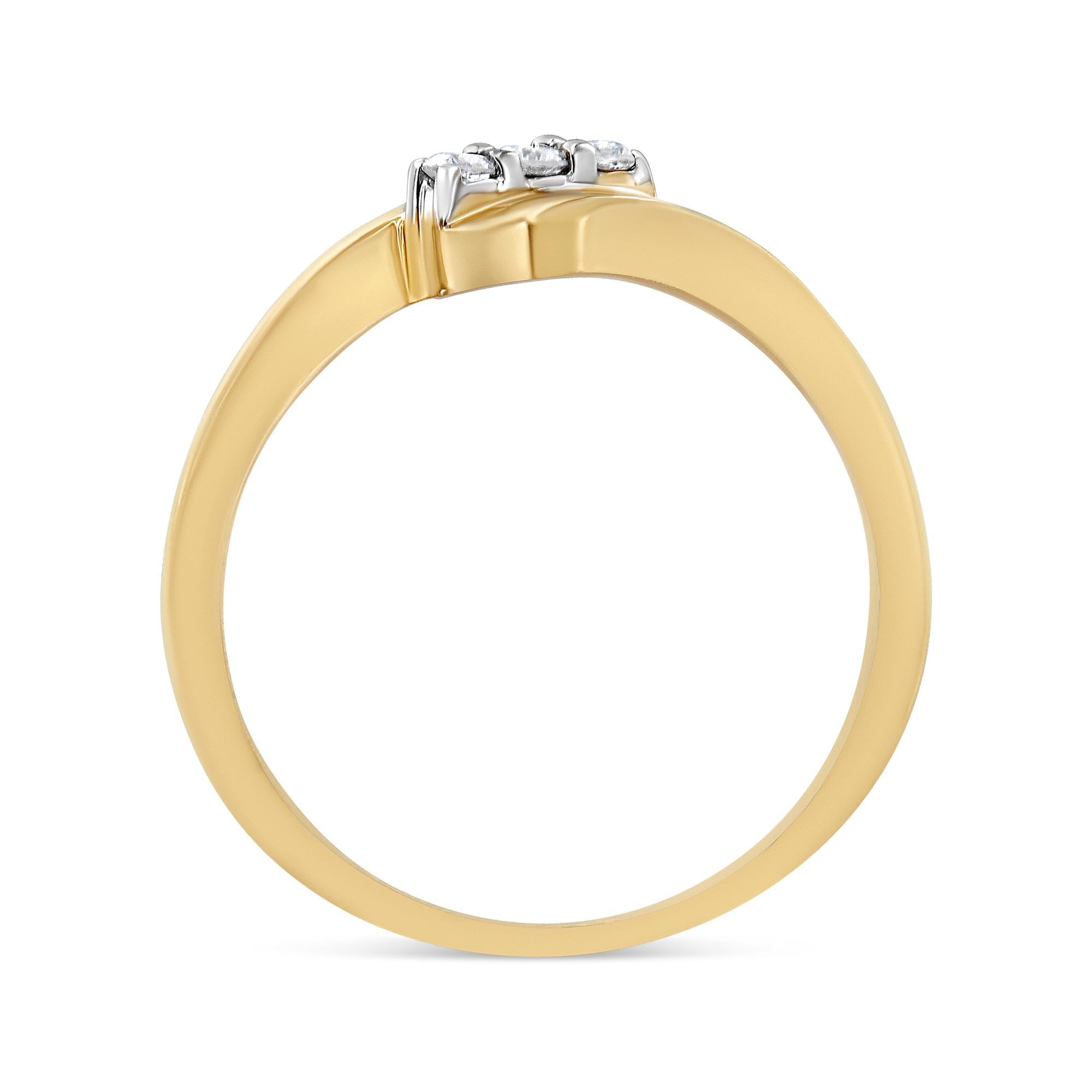 Gold ring with a smooth band and three small diamonds set in silver on the top.