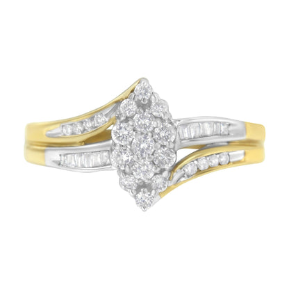 Gold and silver ring with clustered round diamonds and split shank design.