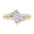 Gold and silver ring with clustered round diamonds and split shank design.