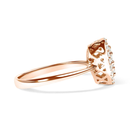Rose gold ring with a round diamond setting and intricate lattice design on the band.