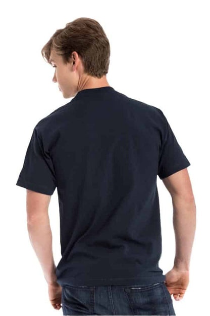 Young man in a navy T-shirt and jeans, turned away, on a white background.