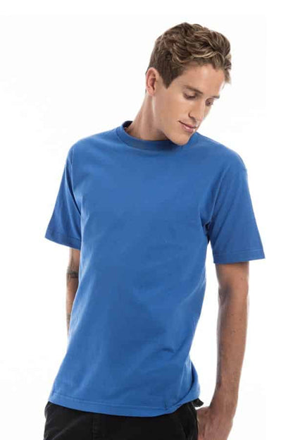 Person in a plain blue T-shirt and black pants, standing against a white background.