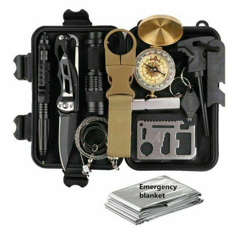 Black survival kit with knife, flashlight, compass, multitool, and beige strap; silver blanket below.