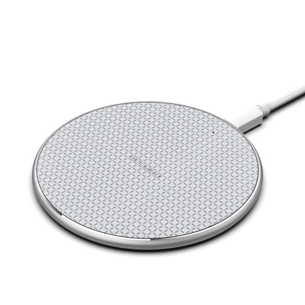 A round, silver-toned wireless charging pad with a textured grid surface and a connecting cable.