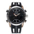 Black and silver watch with a black dial, white markers, digital display, and day of the week feature.