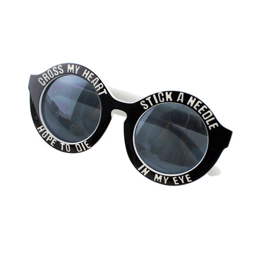 Black round sunglasses with playful white text around lenses.