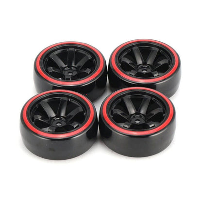 Four black wheels with red rims, arranged in a square, on a white background.