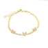 Gold bracelet with three crystal-studded butterfly charms on a smooth chain, featuring an adjustable clasp.